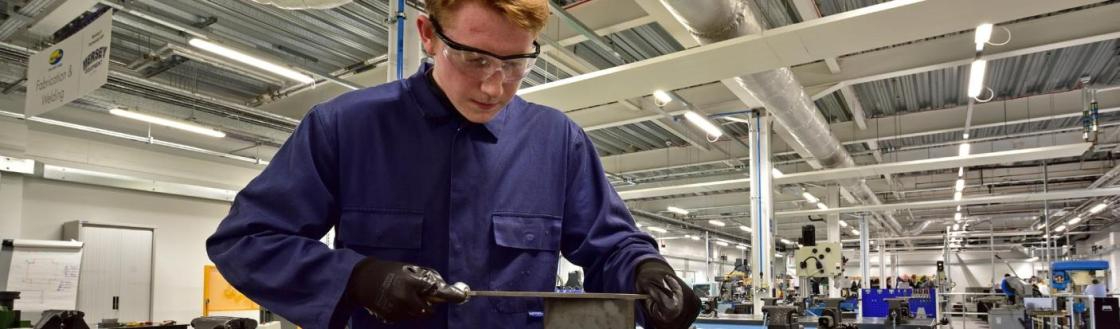 WMC Diploma in Engineering student working inside college classroom