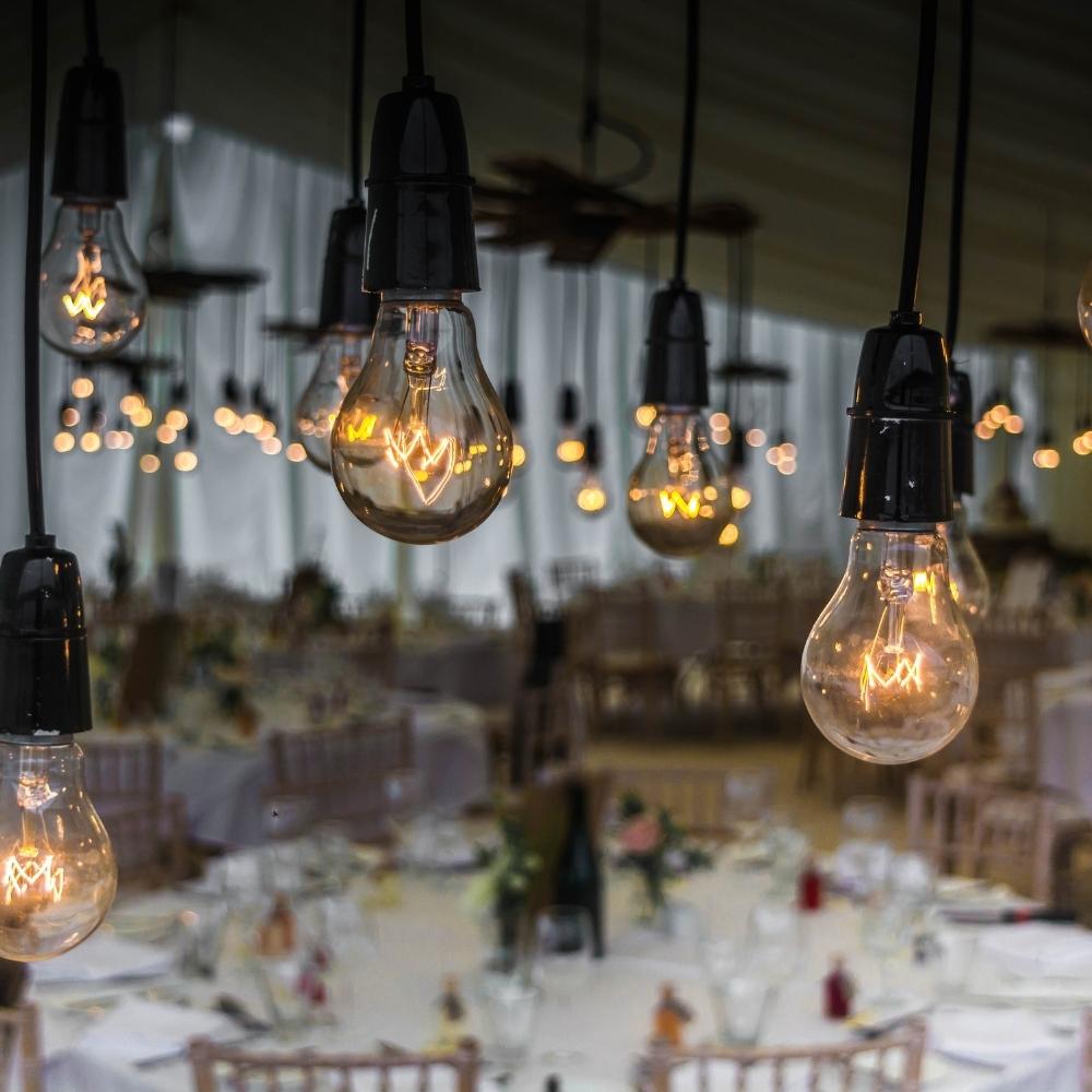 lightbulbs hanging from the ceiling at an event