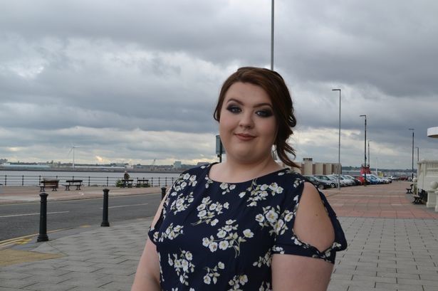 Alisha Nelson a former Wirral Met Health and Social Care student standing near the Floral Pavillion