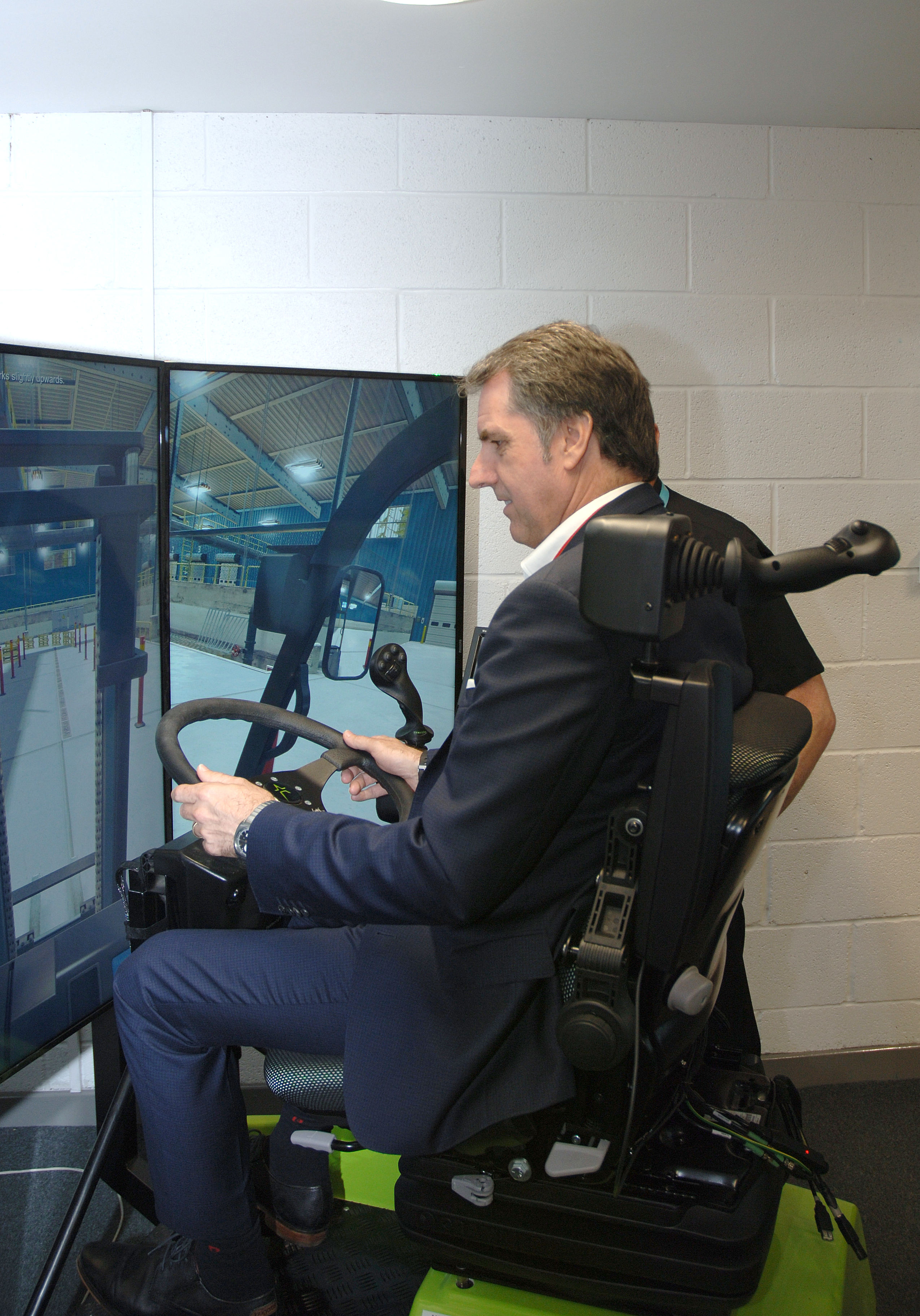 Metro Mayor Steve Rotheram playing a driving test simulation at the Wirral Waters campus