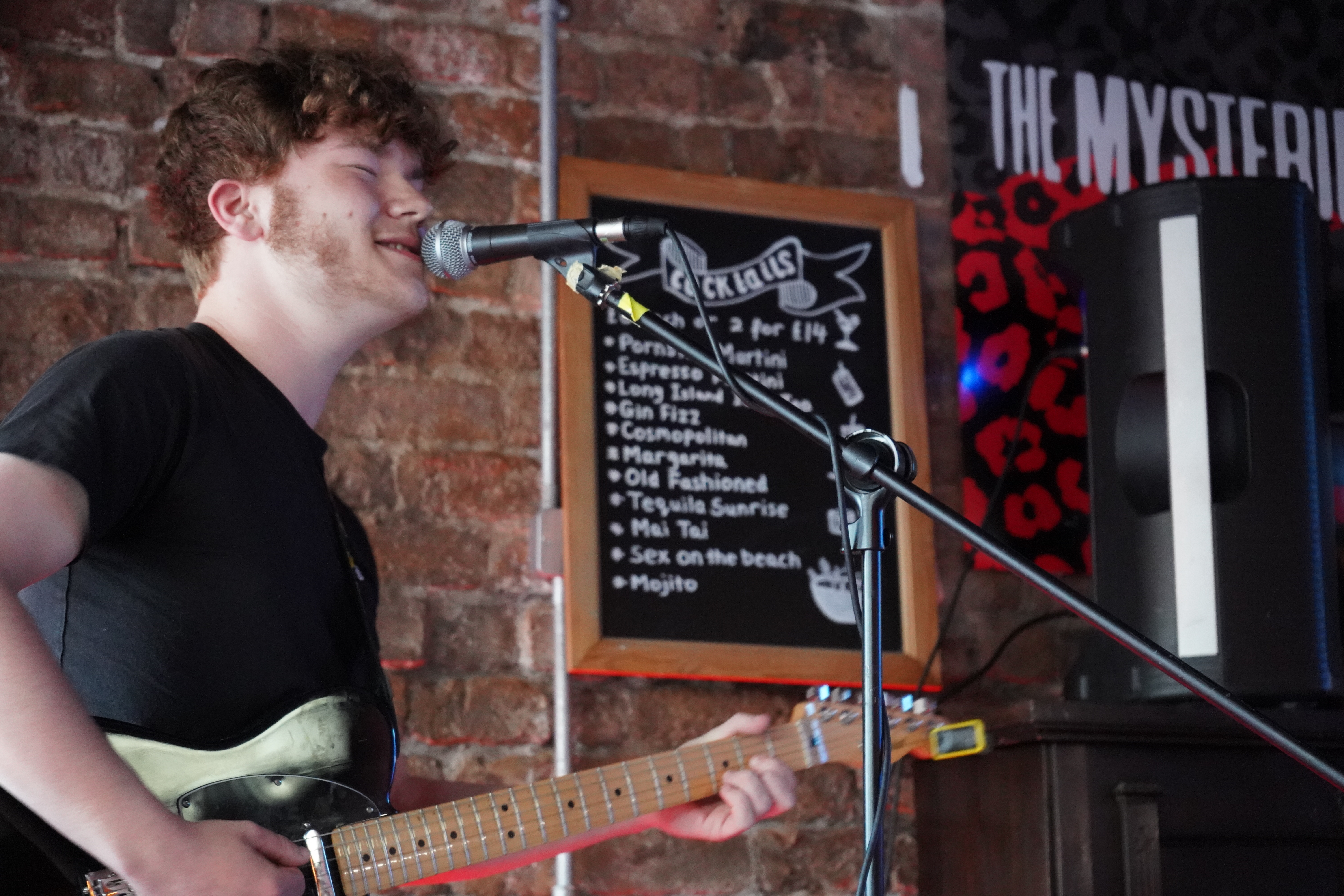 Close up of male student performing at Rockpoint Records