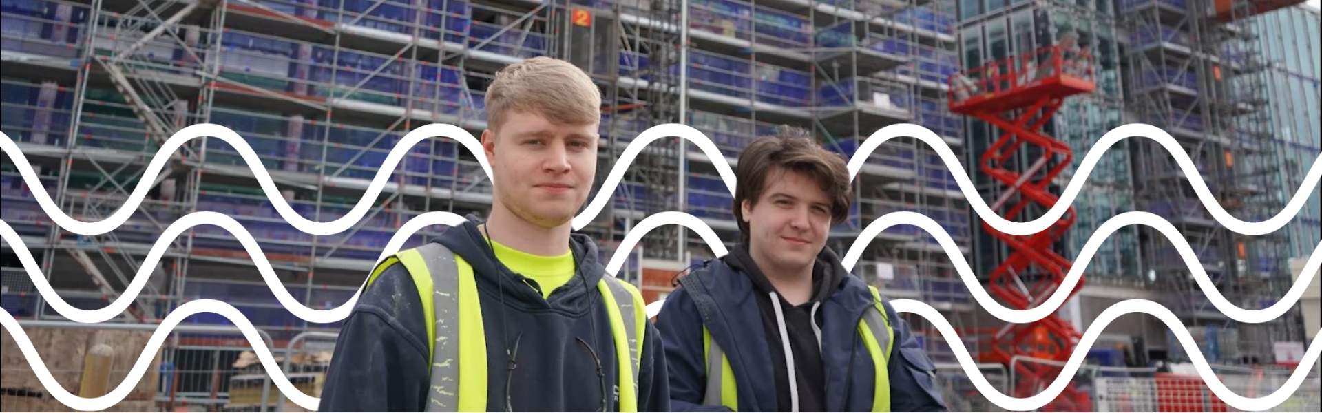 Two Wirral Met apprentices standing in a construction site