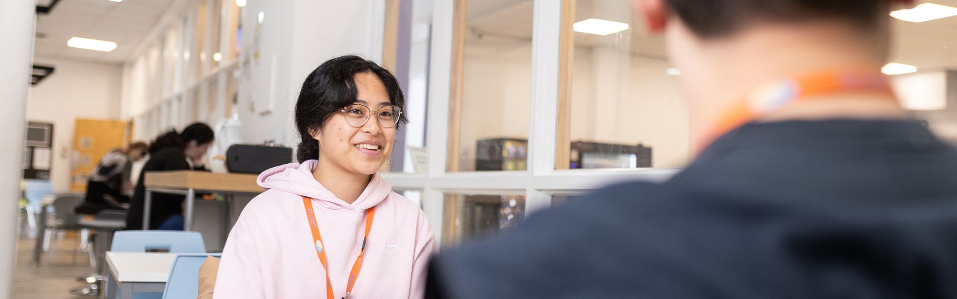 Students sat in a breakout area at Twelve Quays campus