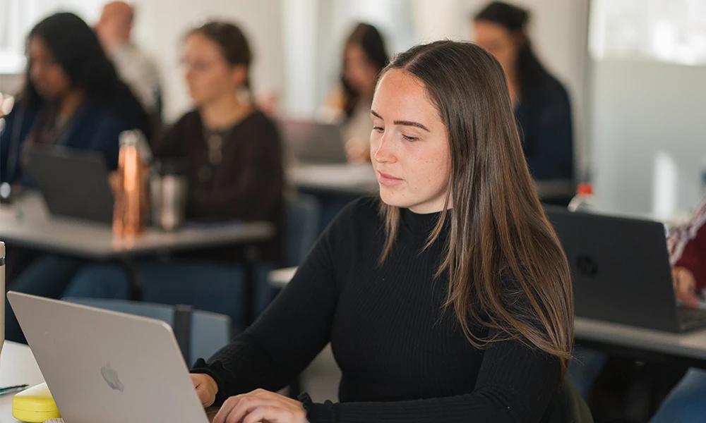 Woman in library with a bookcase