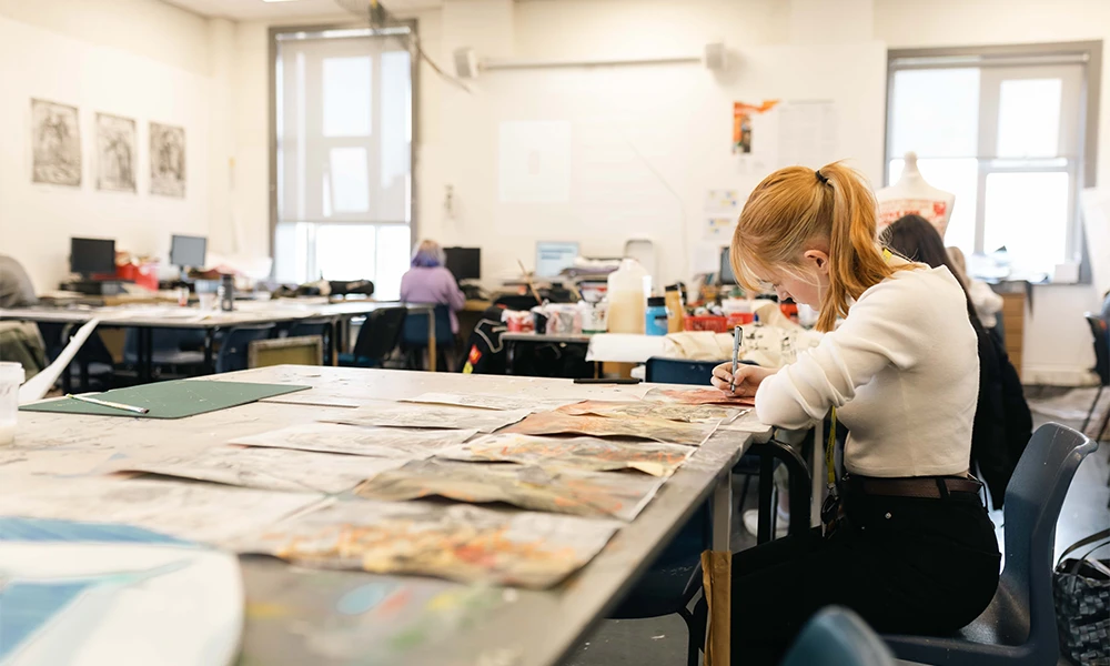 Art students drawing inside classroom