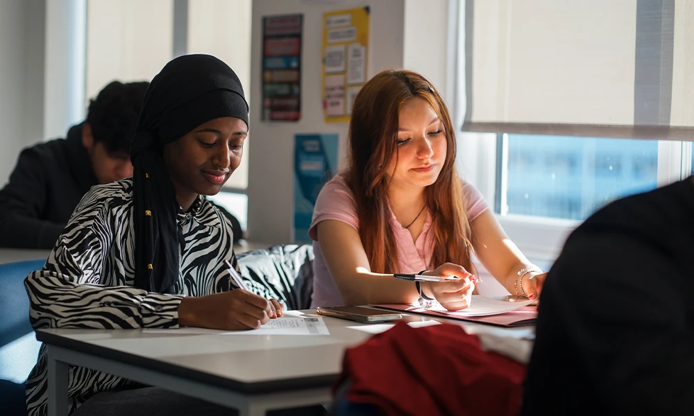 English for Speakers of Other Languages students sat in a classroom