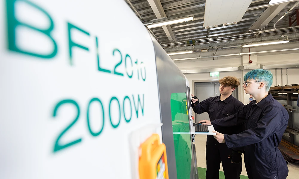 Two Engineering students working inside Twelve Quays workshop