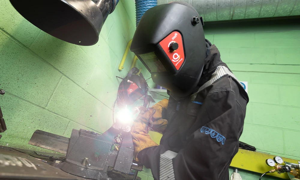 T Level Engineering student welding inside workshop at Twelve Quays