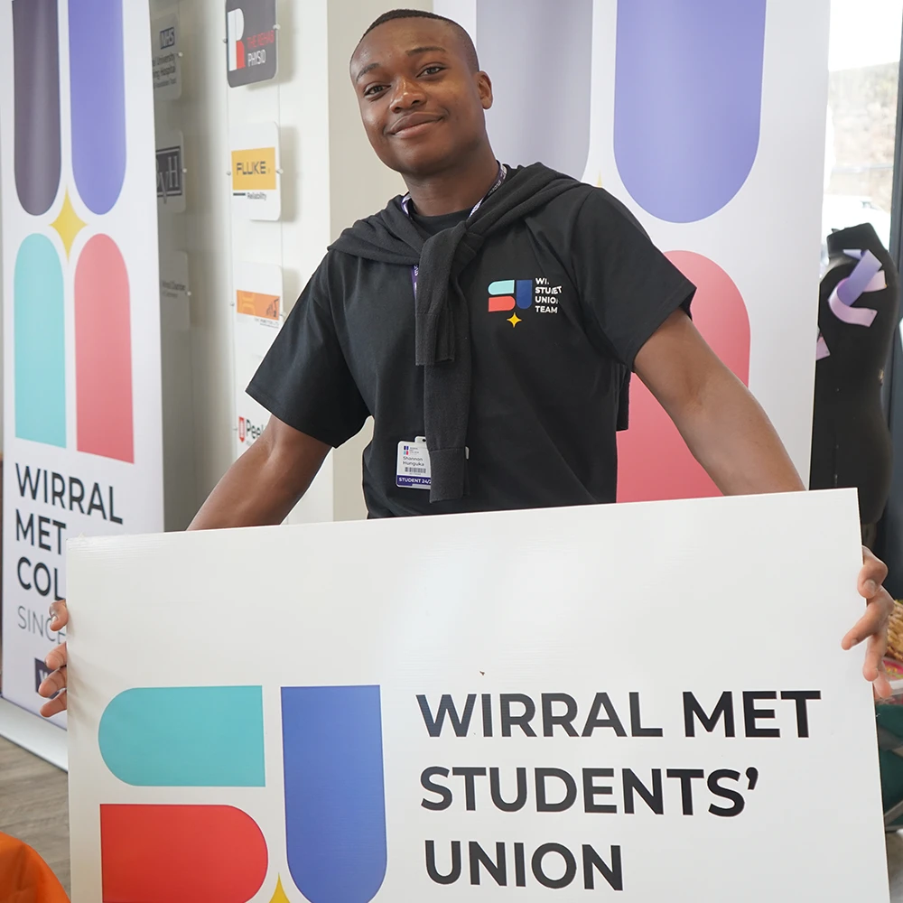 Student Holding SU banner